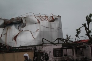A coconut oil tank that was lifted by the tidal surge and moved 1/4 mile hitting the home and killing a woman. 